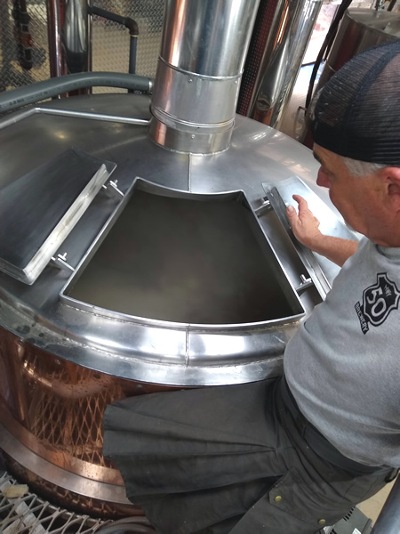 Gary Ritz checks the kettle during Hwy 50 Brewery's first brew day.