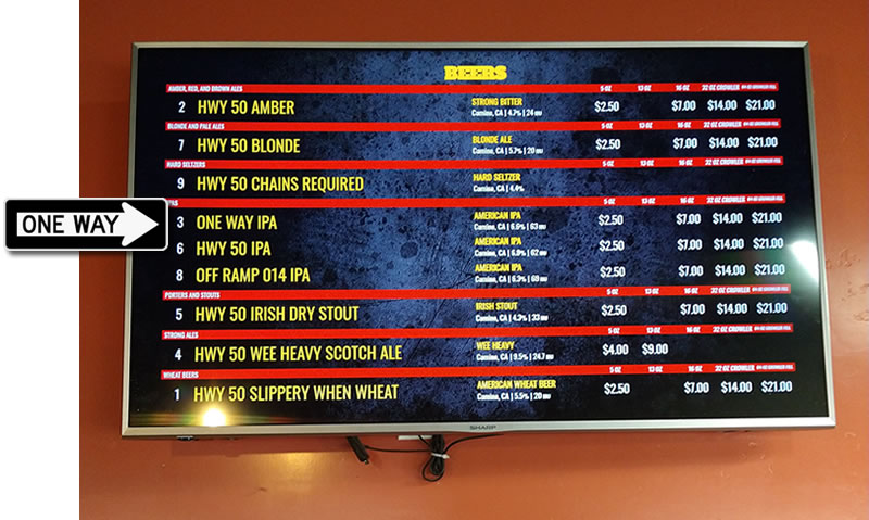 Tap room menu board showing One Way IPA and prices