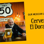 Gary Ritz behind brewery bar with pint of new beer, Cerveza El Dorado.
